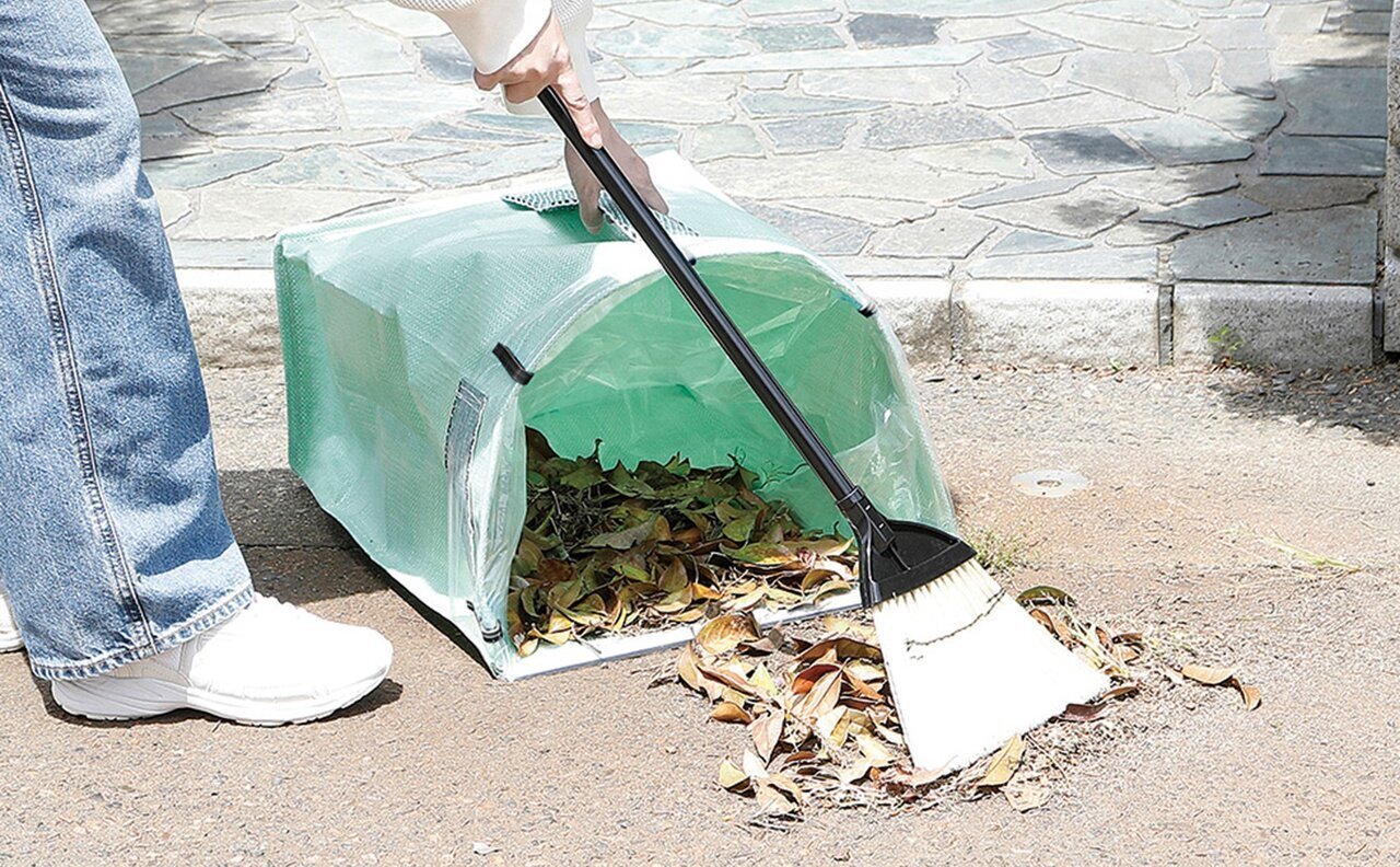"From the Home Center: This combination of dustpan and trash can is incredibly useful for visiting graves!"