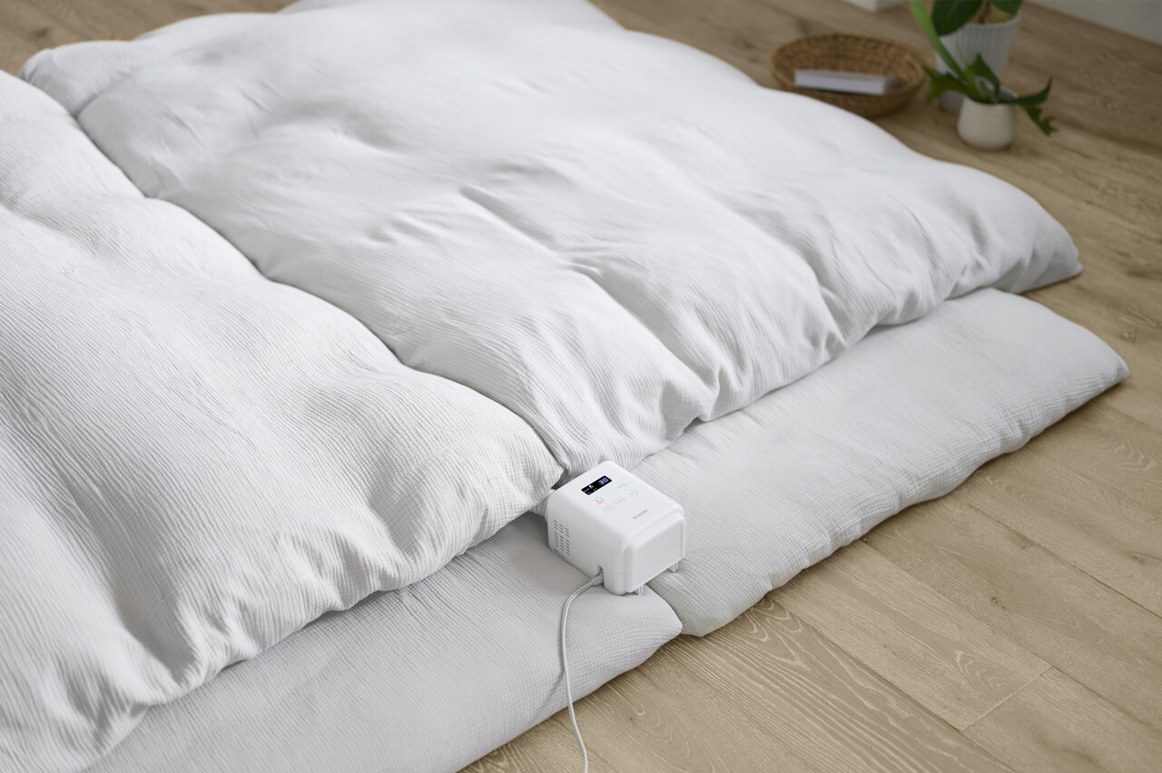 2枚のふとんを温めている様子