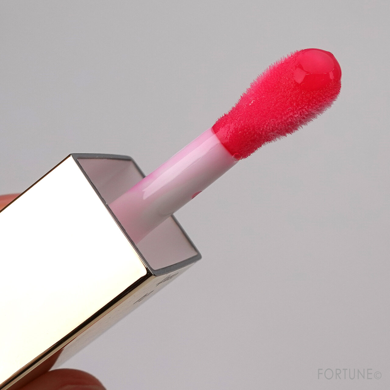 クラランス｜コンフォート リップオイル（04：キャンディー）