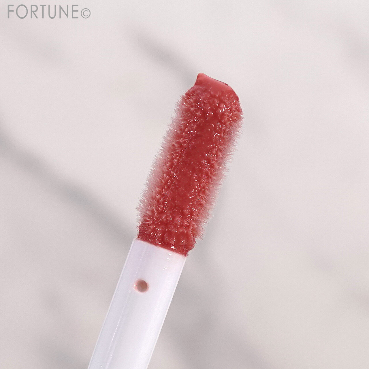 DECORTÉ（コスメデコルテ）　『コスメデコルテ プランピング リップセラム WHITE BLISS』　「05 winter bouquet」